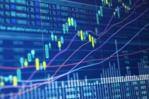 yellow and blue candlestick trading chart tight crop computer screen