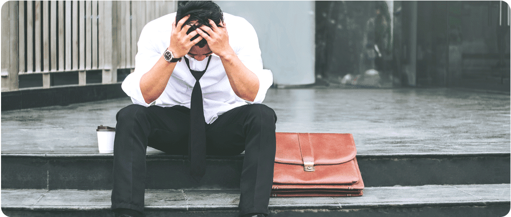 Stressed out businessman on steps