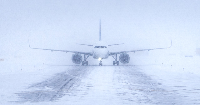 Grounded airplane in winter storm